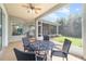 Covered patio featuring outdoor seating, ceiling fans and access to a screened in porch at 2417 Se 23Rd St, Ocala, FL 34471