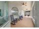 Relaxing covered patio with ceiling fans, tiled floor and screened in porch at 2417 Se 23Rd St, Ocala, FL 34471