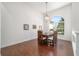 Cozy dining area features hardwood flooring, pendant lighting, and a large window at 2417 Se 23Rd St, Ocala, FL 34471