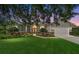 Charming home with a well-manicured lawn and stone accents beneath the windows during twilight at 2417 Se 23Rd St, Ocala, FL 34471