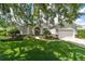 Charming home with a well-manicured lawn and stone accents beneath the windows at 2417 Se 23Rd St, Ocala, FL 34471