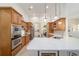 Well-equipped kitchen features wood cabinets, modern appliances, and a large island for food preparation at 2417 Se 23Rd St, Ocala, FL 34471