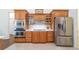 This modern kitchen is equipped with stainless steel appliances, custom cabinets, and tile backsplash at 2417 Se 23Rd St, Ocala, FL 34471
