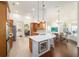 Open kitchen with stainless steel appliances, custom cabinetry, and a breakfast bar that seats four at 2417 Se 23Rd St, Ocala, FL 34471