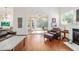 Comfortable living room with a fireplace, hardwood flooring, and sliding glass doors to lanai at 2417 Se 23Rd St, Ocala, FL 34471