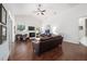 Spacious living room with vaulted ceiling, fireplace, and hardwood floors at 2417 Se 23Rd St, Ocala, FL 34471