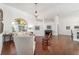 Bright and airy living area boasts hardwood flooring, white walls, and elegant lighting fixtures at 2417 Se 23Rd St, Ocala, FL 34471
