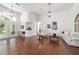 Bright living area boasts hardwood floors, white walls, and elegant lighting fixtures at 2417 Se 23Rd St, Ocala, FL 34471