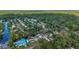 A tranquil community surrounded by lush green forests and waterways from above at 24628 Fox Rd, Astor, FL 32102