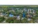 Aerial view showcasing a residential neighborhood with a canal and lush greenery at 24628 Fox Rd, Astor, FL 32102