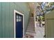 Back entrance with outdoor staircase and covered porch at 24628 Fox Rd, Astor, FL 32102