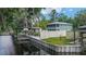 Waterfront home with a covered boat dock, seawall, and fenced yard at 24628 Fox Rd, Astor, FL 32102