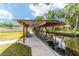 Waterfront home with a covered boat dock and lift on the river, perfect for boating and fishing at 24628 Fox Rd, Astor, FL 32102
