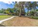 Lush property with waterfront access and a covered dock, ideal for boating and enjoying the natural surroundings at 24628 Fox Rd, Astor, FL 32102