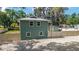 A horizontal siding home has a metal roof and fenced-in back yard, offering both style and security at 24628 Fox Rd, Astor, FL 32102