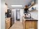 This is a kitchen with wood counters, stainless steel appliances and wood cabinets at 24628 Fox Rd, Astor, FL 32102