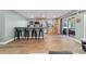 Kitchen featuring a breakfast bar, stainless steel appliances, and light wood cabinetry at 24628 Fox Rd, Astor, FL 32102