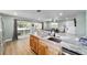 Kitchen with island and granite countertops overlooking the living room at 24628 Fox Rd, Astor, FL 32102