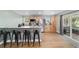 Kitchen featuring a breakfast bar, stainless steel appliances and a sliding glass door to the outside at 24628 Fox Rd, Astor, FL 32102
