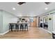 Kitchen featuring a breakfast bar, stainless steel appliances, and light wood cabinetry at 24628 Fox Rd, Astor, FL 32102