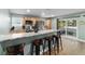 Kitchen featuring a breakfast bar with granite countertops and stainless steel appliances at 24628 Fox Rd, Astor, FL 32102