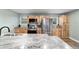 Bright kitchen with granite countertops and stainless steel appliances at 24628 Fox Rd, Astor, FL 32102