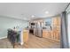 Bright kitchen with stainless steel appliances, breakfast bar, and light wood cabinetry at 24628 Fox Rd, Astor, FL 32102