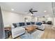 This is an open concept living room with large sectional seating and nice decor at 24628 Fox Rd, Astor, FL 32102