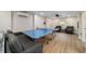 This is an open concept living room with ping pong and comfortable seating at 24628 Fox Rd, Astor, FL 32102