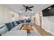 This is an open concept living room with large sectional seating and nice decor at 24628 Fox Rd, Astor, FL 32102