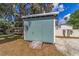 A practical shed near the waterfront, offering additional storage space for kayaks and outdoor equipment at 24628 Fox Rd, Astor, FL 32102