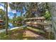 Scenic waterfront view with a rack of kayaks, perfect for water enthusiasts to explore the serene waterway at 24628 Fox Rd, Astor, FL 32102