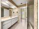 Bathroom vanity featuring double doors to toilet and shower areas at 28 Golf View Dr, Ocala, FL 34472