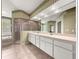 Bathroom features tub, shower, and and sinks at 28 Golf View Dr, Ocala, FL 34472