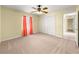 Bright bedroom with ceiling fan, neutral carpet, and closet at 28 Golf View Dr, Ocala, FL 34472