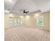 Spacious bedroom with tray ceiling, fan, and sliding door at 28 Golf View Dr, Ocala, FL 34472