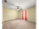 Bedroom with neutral carpet, ceiling fan and pink curtains at 28 Golf View Dr, Ocala, FL 34472