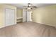 Bedroom with neutral carpet, ceiling fan, closet, and built-in desk at 28 Golf View Dr, Ocala, FL 34472