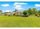 Attractive single-story house with expansive lawn and mature trees at 28 Golf View Dr, Ocala, FL 34472