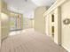 Open foyer with neutral carpet, tile entryway, and natural light at 28 Golf View Dr, Ocala, FL 34472