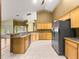 Well-lit kitchen boasting stainless steel appliances, ample countertop space, and a functional design for easy meal preparation at 28 Golf View Dr, Ocala, FL 34472