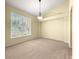 Bright, airy room with neutral carpet and a large window at 28 Golf View Dr, Ocala, FL 34472