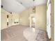 Spacious room with neutral walls, carpet flooring, and a pendant light fixture at 28 Golf View Dr, Ocala, FL 34472