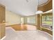 Relaxing living room with hardwood floors, a cozy bay window, and seamless flow to other rooms for versatile living at 28 Golf View Dr, Ocala, FL 34472