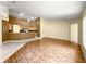 Spacious living room and kitchen area with wood and tile floors at 28 Golf View Dr, Ocala, FL 34472