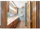 Traditional bathroom featuring double vanity, wooden cabinets, and blue walls at 2820 Se 14Th St, Ocala, FL 34471