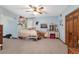 Bedroom with blue walls, ceiling fan and a double door closet at 2820 Se 14Th St, Ocala, FL 34471