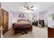 Spacious bedroom with ceiling fan, closet, and desk area at 2820 Se 14Th St, Ocala, FL 34471