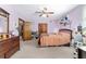 Bedroom features carpeted flooring, ceiling fan, and closet at 2820 Se 14Th St, Ocala, FL 34471