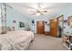 Bedroom with carpeted flooring, ceiling fan, closet, and desk at 2820 Se 14Th St, Ocala, FL 34471